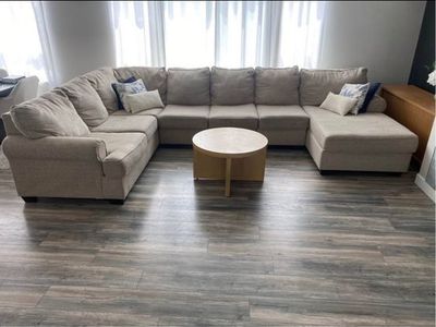 Large Beige U-Shaped Sectional Couch