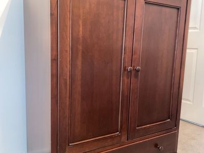 Armoire is solid mahogany wood with Cabinet and Drawer Mahogany low Sean Finish