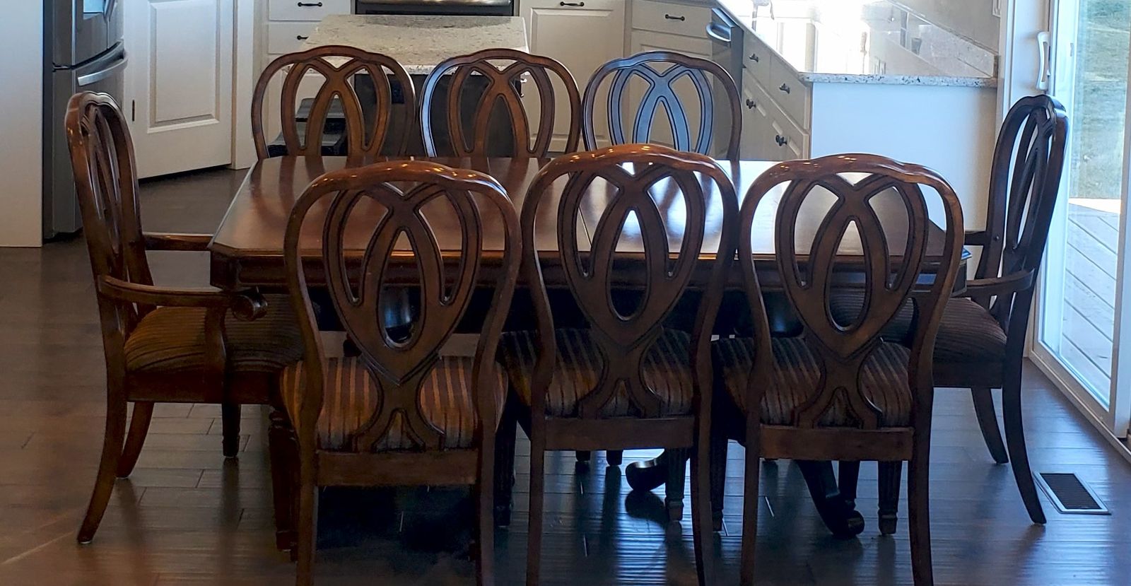 Beautiful, sturdy, table with a leaf and 8 chairs