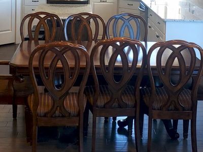 Beautiful, sturdy, table with a leaf and 8 chairs