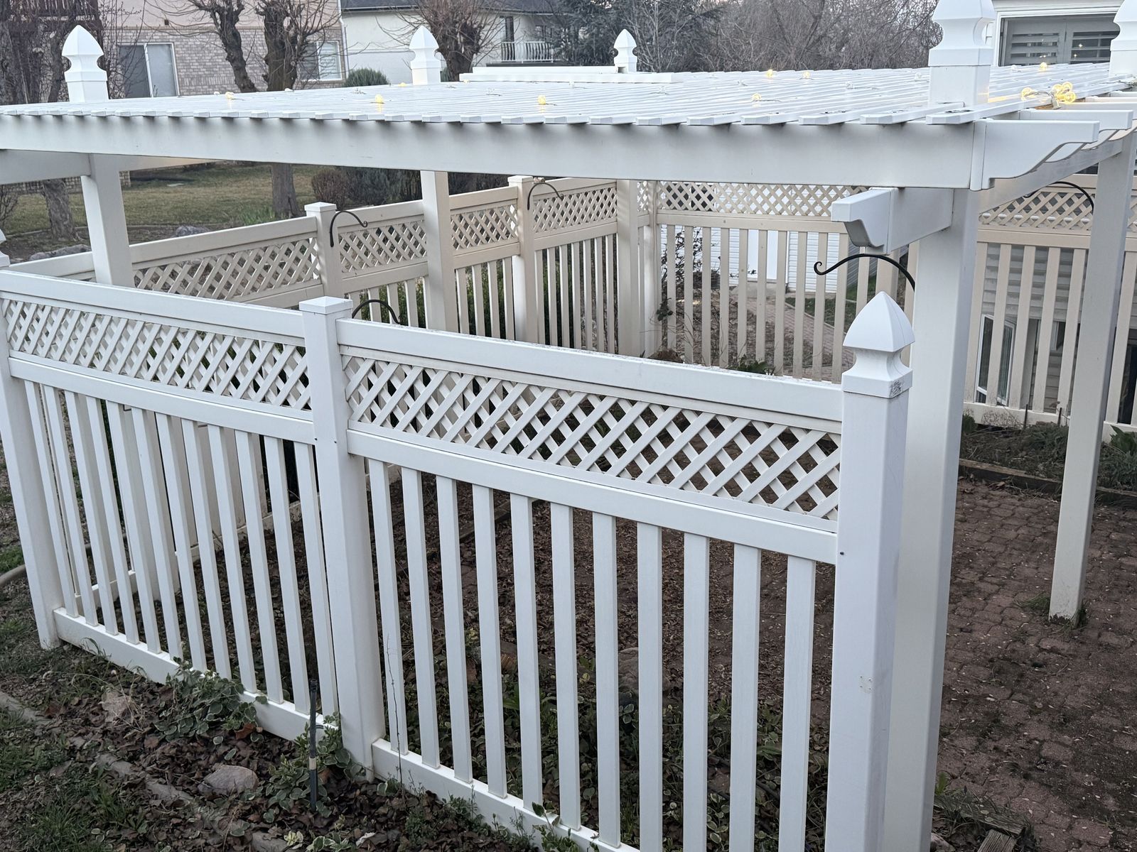 White Vinyl Pergola with Lattice Privacy Fencing and Posts