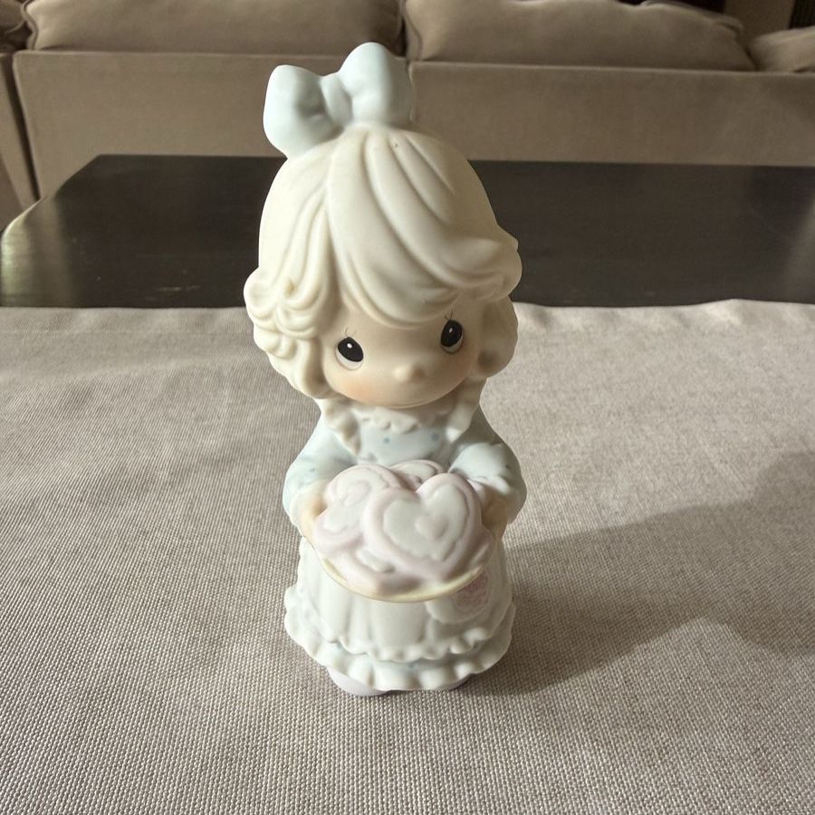 This is a Precious Moments "You're The Sweetest Cookie In The Batch" porcelain figurine.