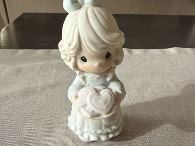 This is a Precious Moments "You're The Sweetest Cookie In The Batch" porcelain figurine.