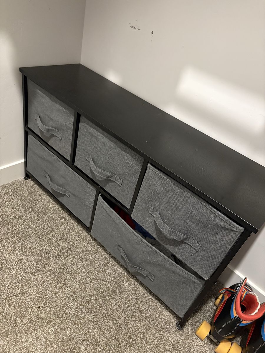 Black shelves with fabric boxes