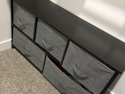 Black shelves with fabric boxes