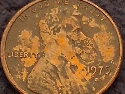1975 D penny with die clash error on the mouth $10