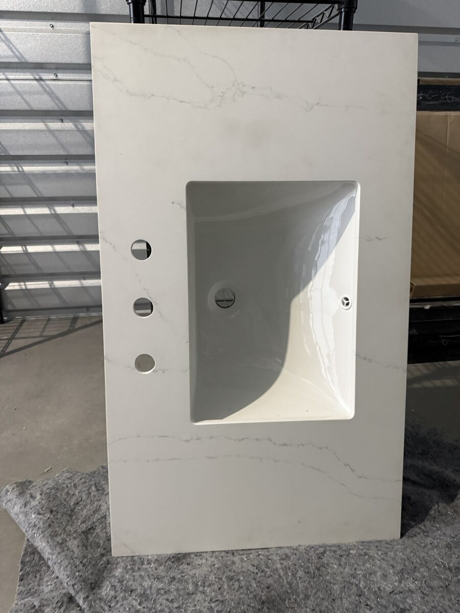 Vanity countertop with sink and backsplash