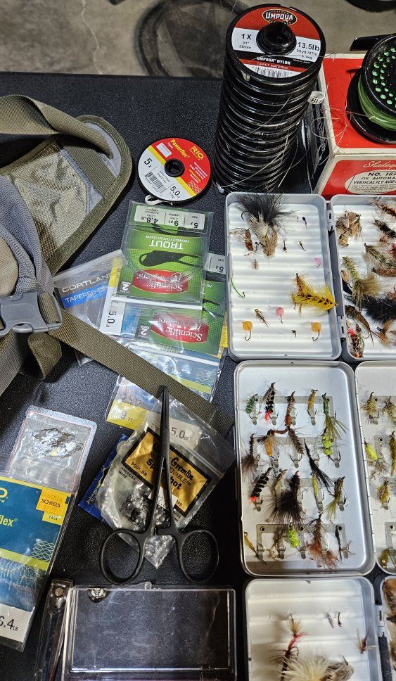 Simms fly fishing case and a ton of Flies  and extras.