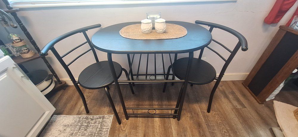 Compact Black Metal Bistro Dining Set with 2 Chairs & Storage Shelf