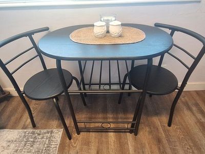 Compact Black Metal Bistro Dining Set with 2 Chairs & Storage Shelf