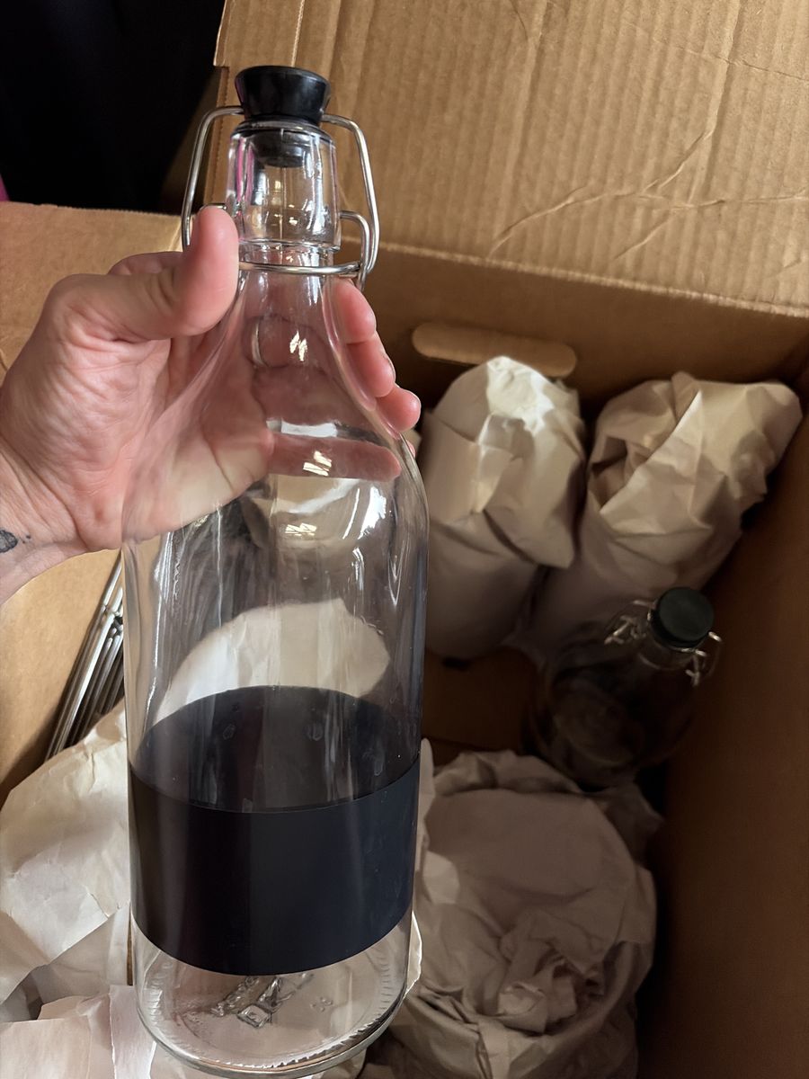 Clear Glass Swing Top Bottle with Black Rubber Stopper - Versatile Beverage Container