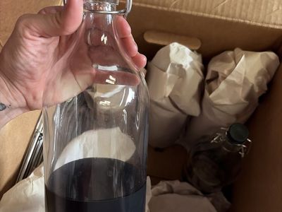 Clear Glass Swing Top Bottle with Black Rubber Stopper - Versatile Beverage Container
