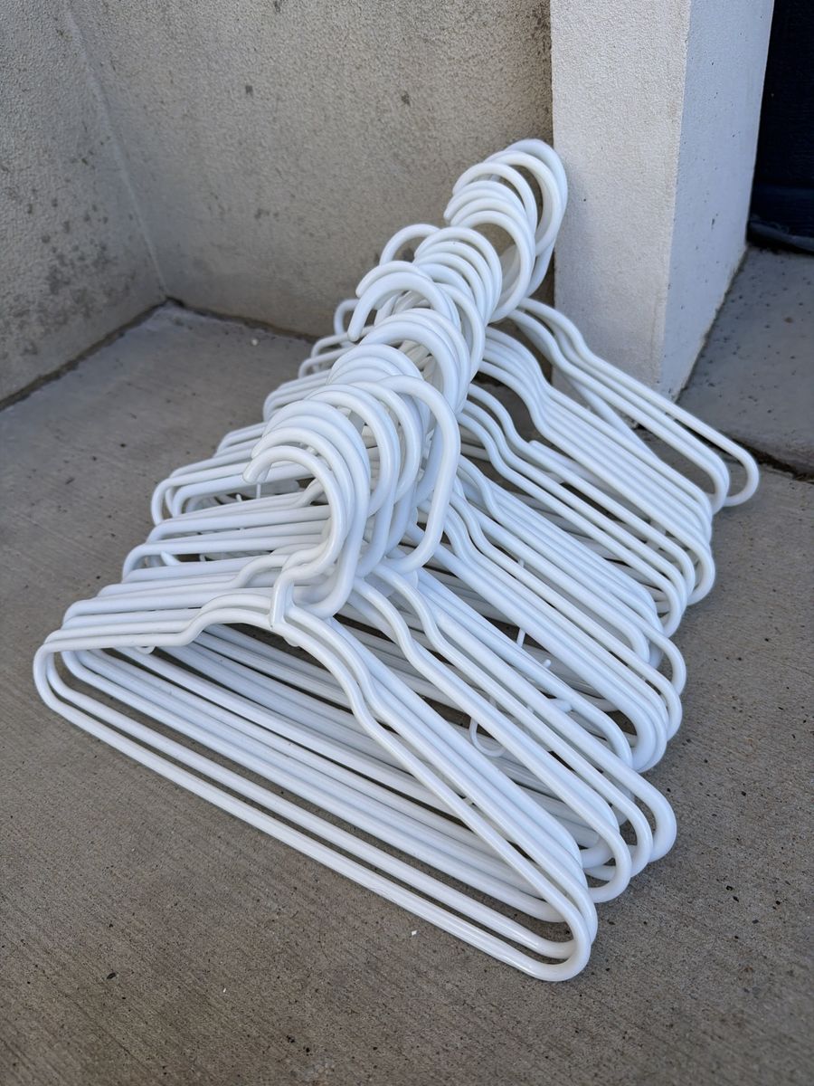 Lot of White Plastic Clothing Hangers