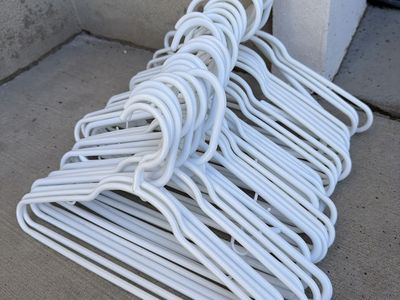 Lot of White Plastic Clothing Hangers