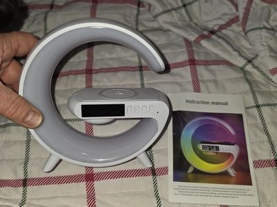iphone and other phones: Multifunction Smart Speaker, 5W Wireless Charger, Bluetooth Speaker & Clock.