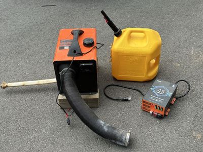 Portable Diesel Air Heater, Fuel Can, and VEVOR 45 Amp Smart RV Converter Charger Setup