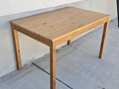 IKEA Pine Wood Dining Table - Solid Wood Construction, Versatile & Durable