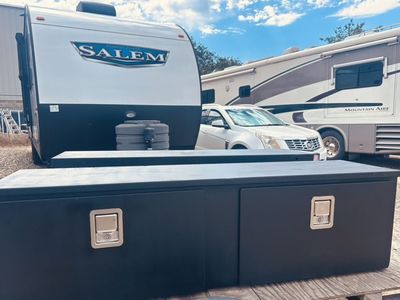 TWO BLACK STEEL UNDERBODY TOOL BOXES