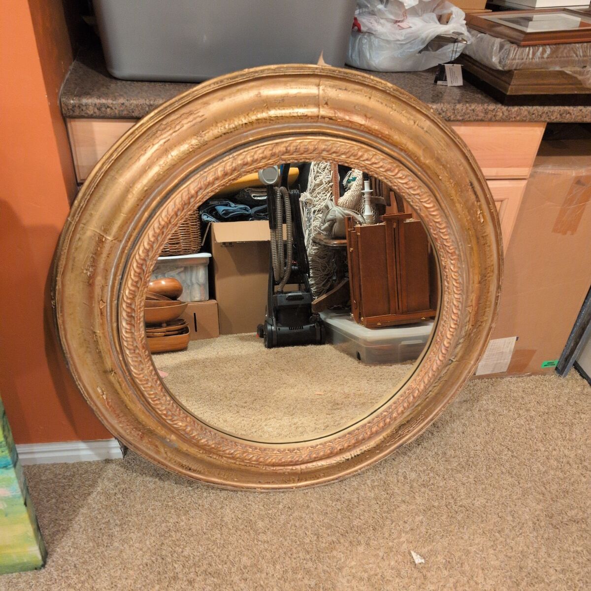 large round gold mirror