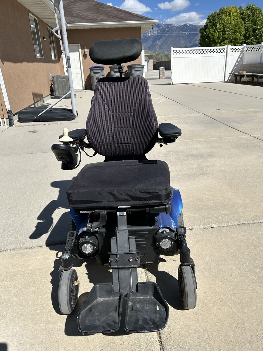 Permobile electric wheelchair.