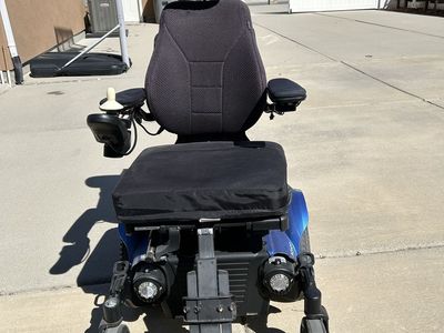 Permobile electric wheelchair.