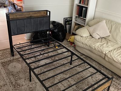Dark wood and metal twin bed frames with charging station and LED light strips