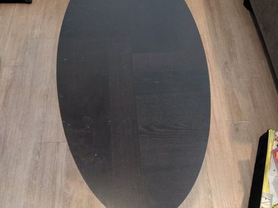 Black Oval Wood Coffee Table with Cross Base