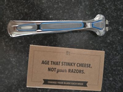 New Dollar Shave Club Chrome Razor Handle with 4 v
blades