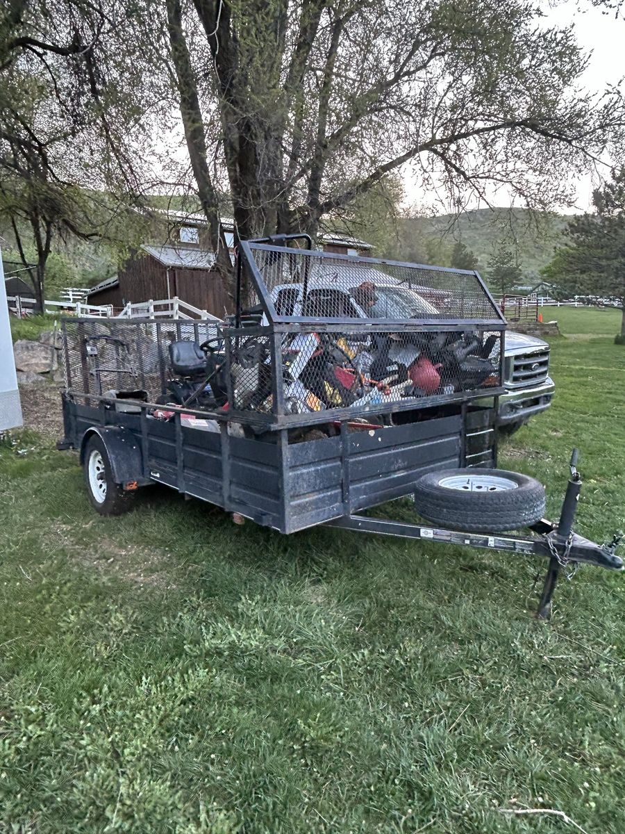 Single Axle Utility Trailer with High Mesh Sides, Ramp, and Spare Tire
