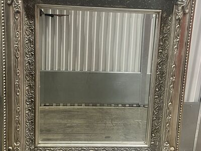 Heavy wooden silver carved vanity mirror