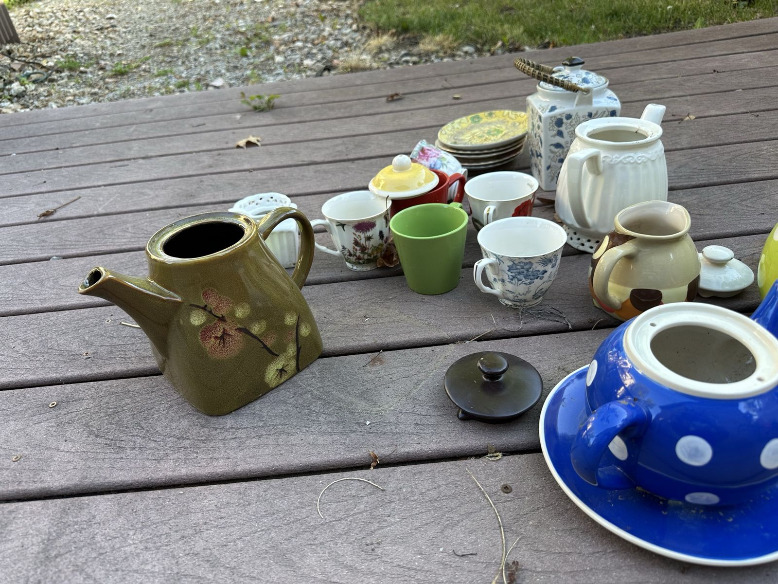 Collection of teapots, tea cups, tea plates
