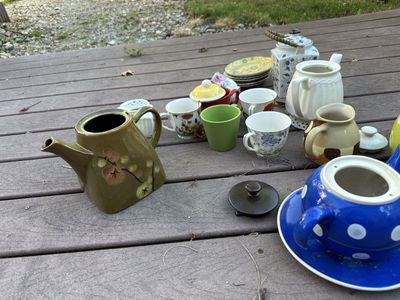 Collection of teapots, tea cups, tea plates