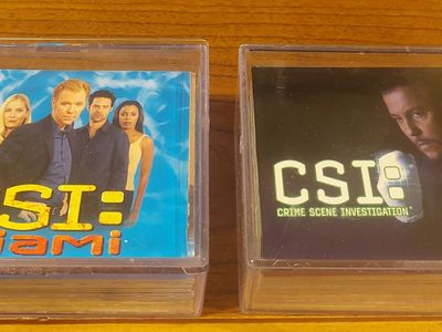 TWO COMPLETE CSI TRADING CARD SETS – 200 CARDS TOTAL!