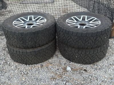 Nitto Recon Grappler A/T Tires on 20" Wheels - 35X12.50R20LT Set of 4