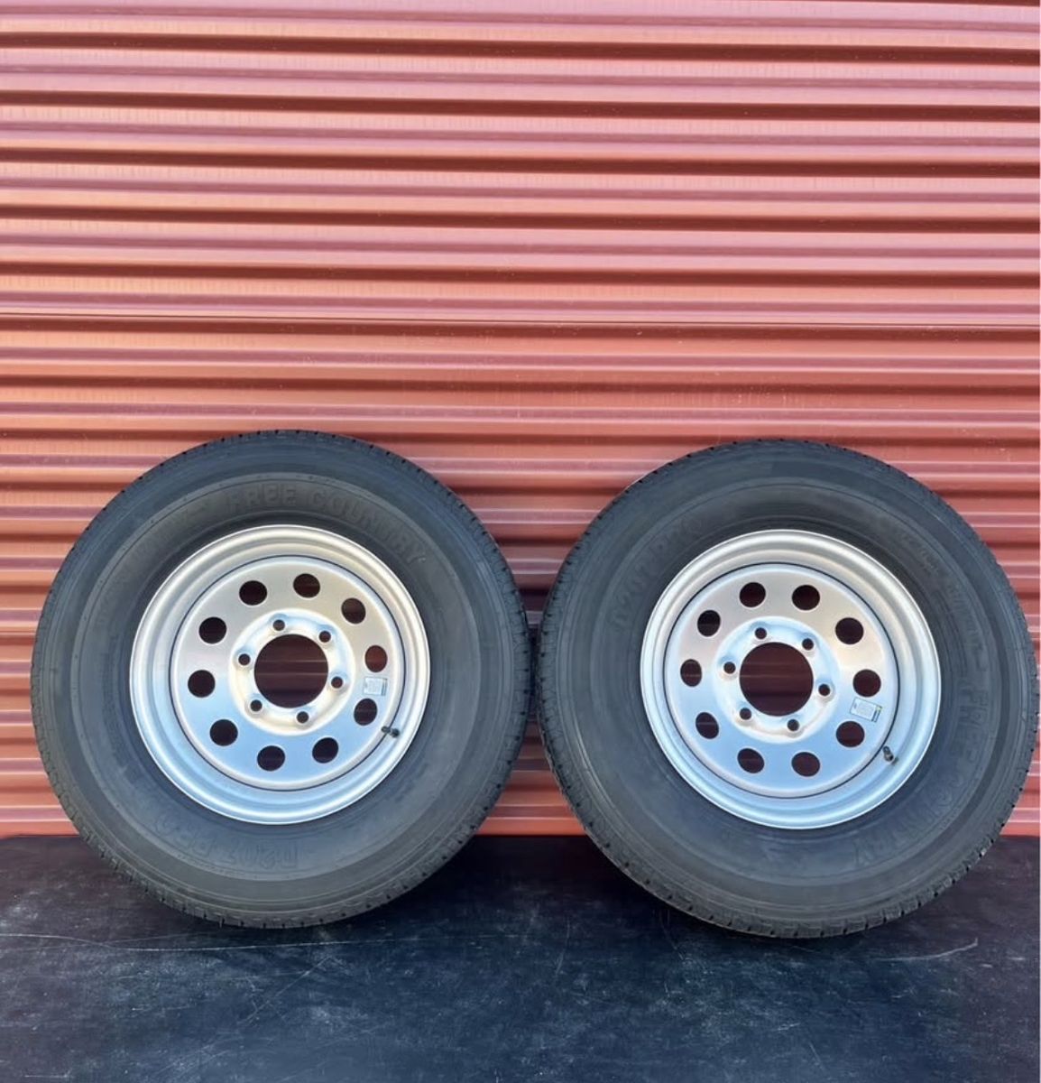 Set of 2 Free Country 225/75 R15 Heavy Duty 10 Ply E Load Trailer Tires Mounted on New Silver Wheels Six Lug Pattern
