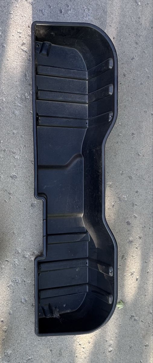 Rear seat storage bin