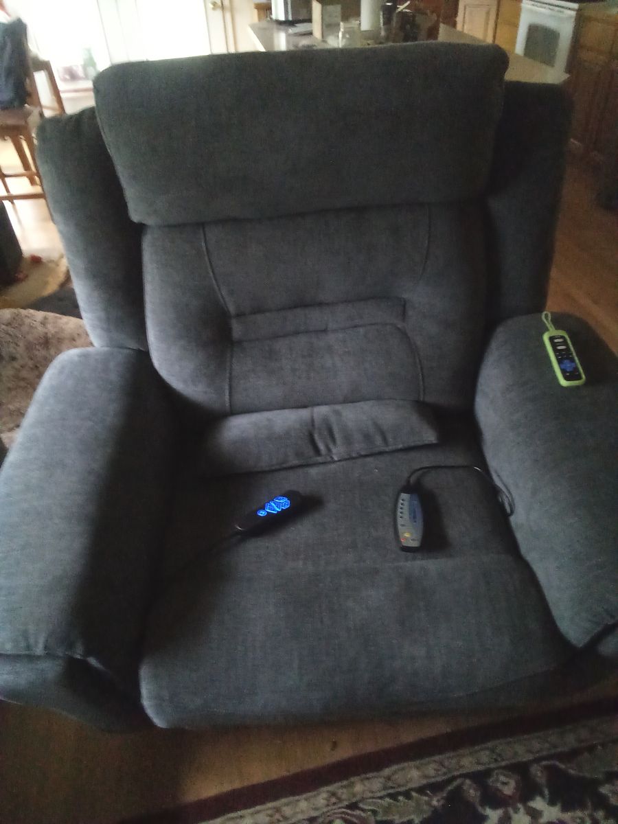 Recliner with heat and massage. Still in box. Can't have my dog.