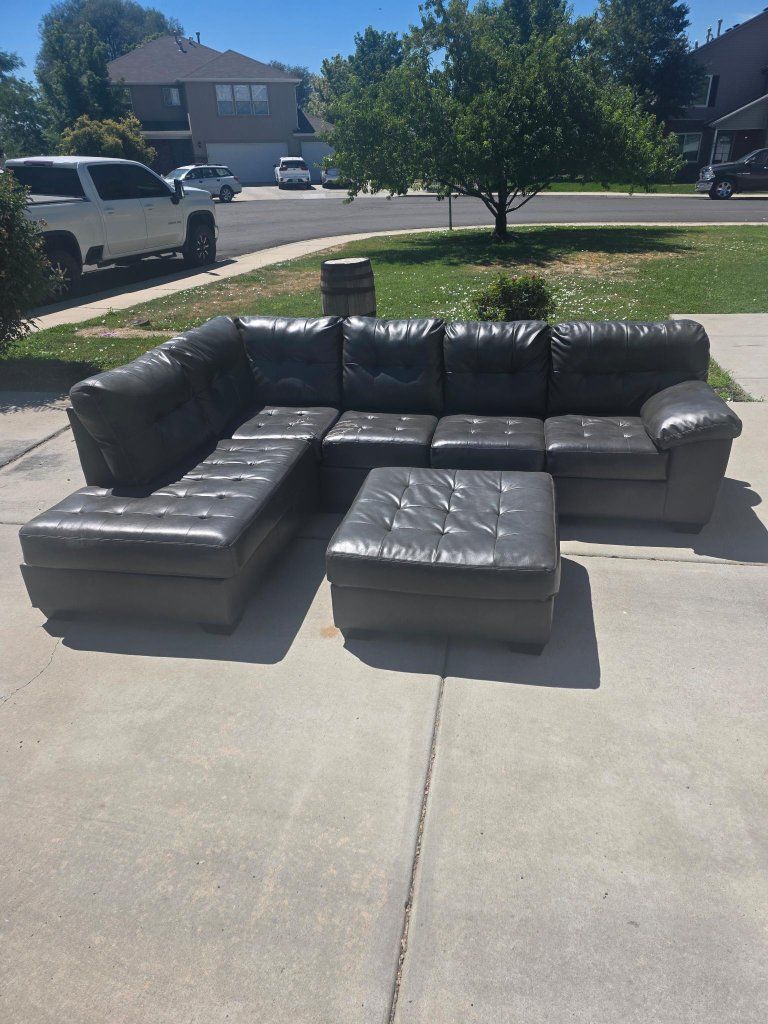 Used Grey Faux Leather Sectional Sofa with Chaise and Ottoman