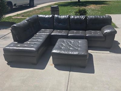 Used Grey Faux Leather Sectional Sofa with Chaise and Ottoman