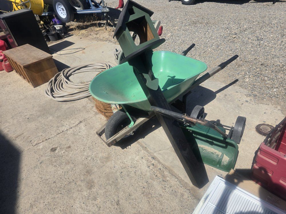 Yard items Hose and roller Wheel Barrow Fertilizer spreader flower baskets