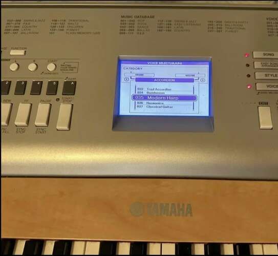 Yamaha YPG-635 88-Key Weighted Portable Grand Piano/ keyboard with AC adapter, music holder, and stand.