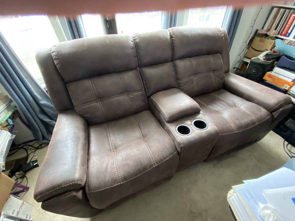 lightly used faux leather 2 seater power reclining couch