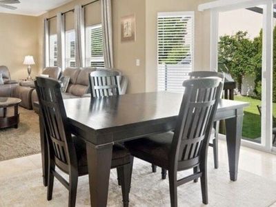 Excellent condition- Dark Wood Dining Table and 6 Chairs (extension piece to make the table larger or smaller)