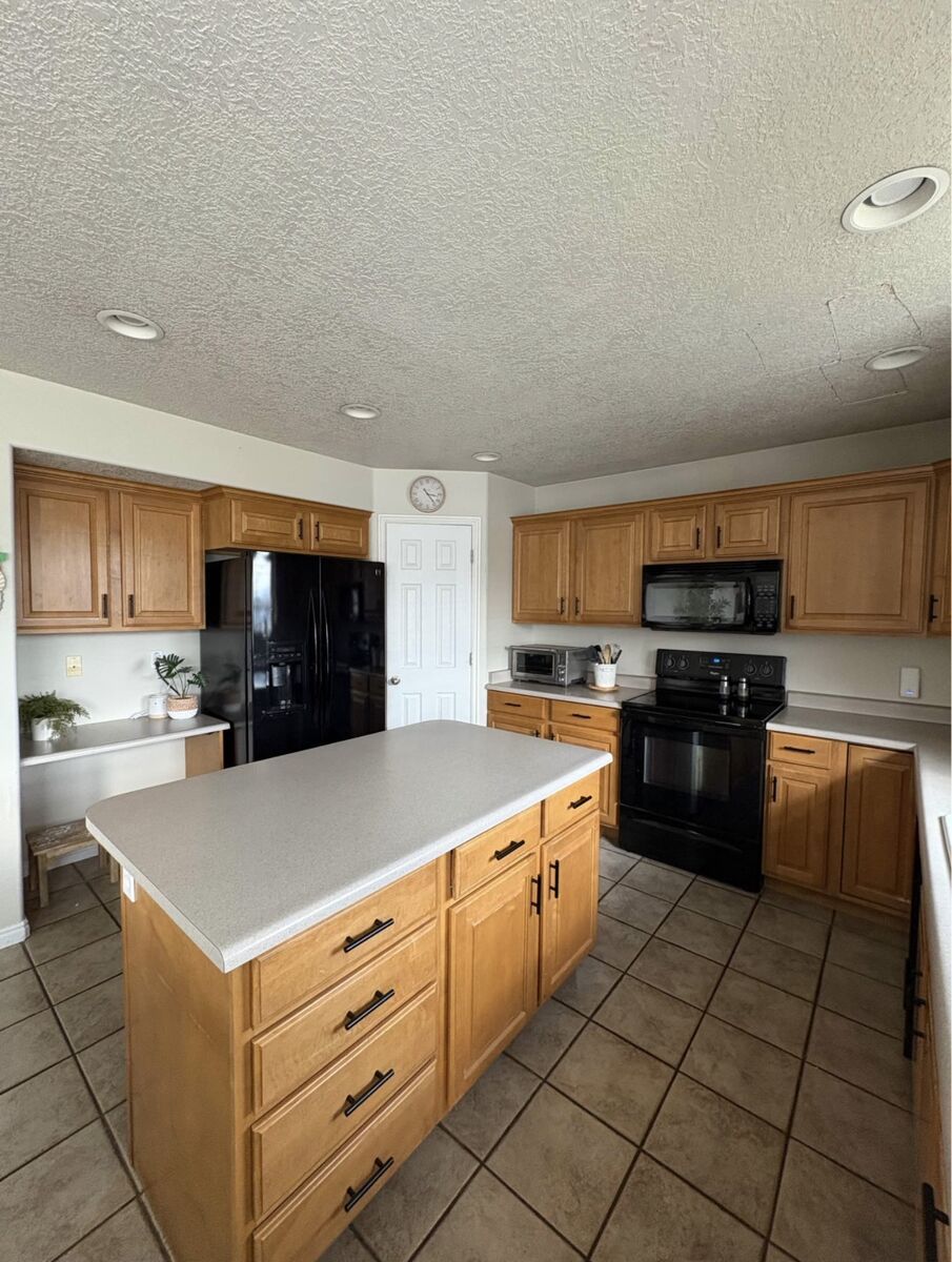 Light Knotty Alder Cabinets & Formica Counter