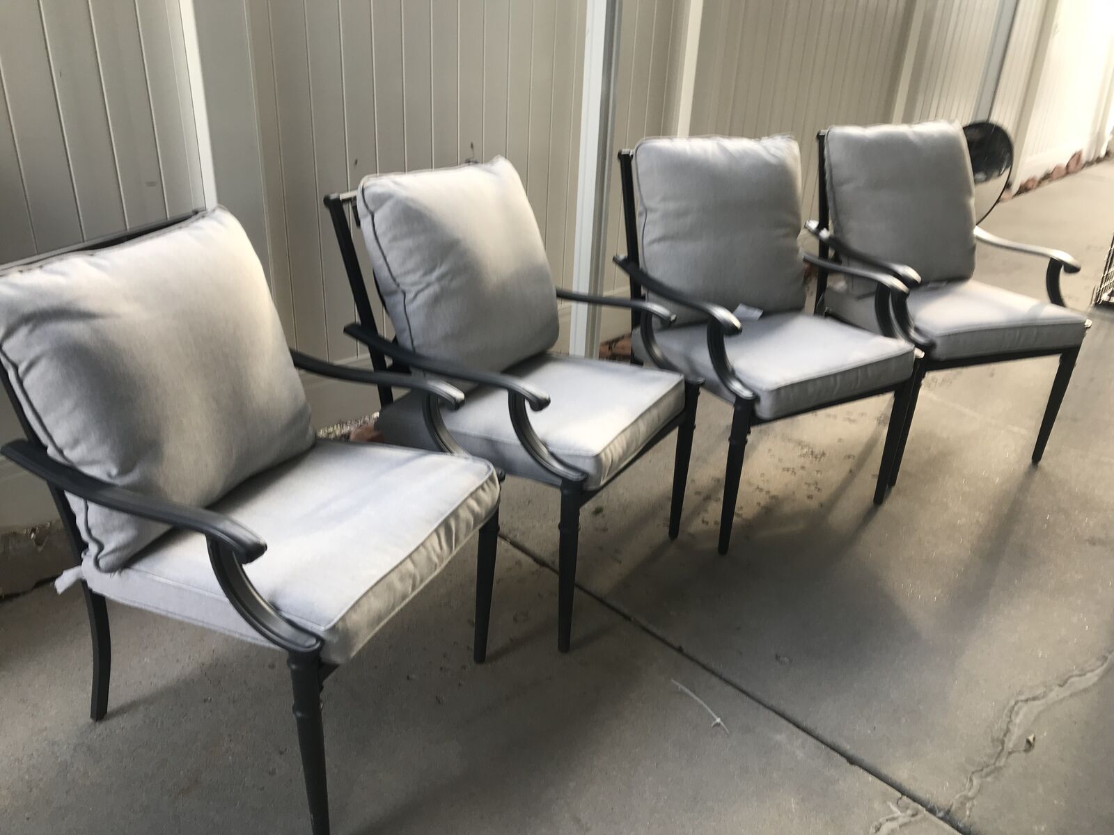 4 outdoor living chairs with weatherproof cushions and pads , new with wear