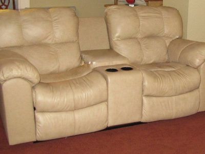Beige Reclining Leather Loveseat with Console and Cup Holders