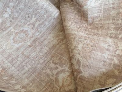 New. Beautiful 9 x 12 mocha washable area rug.