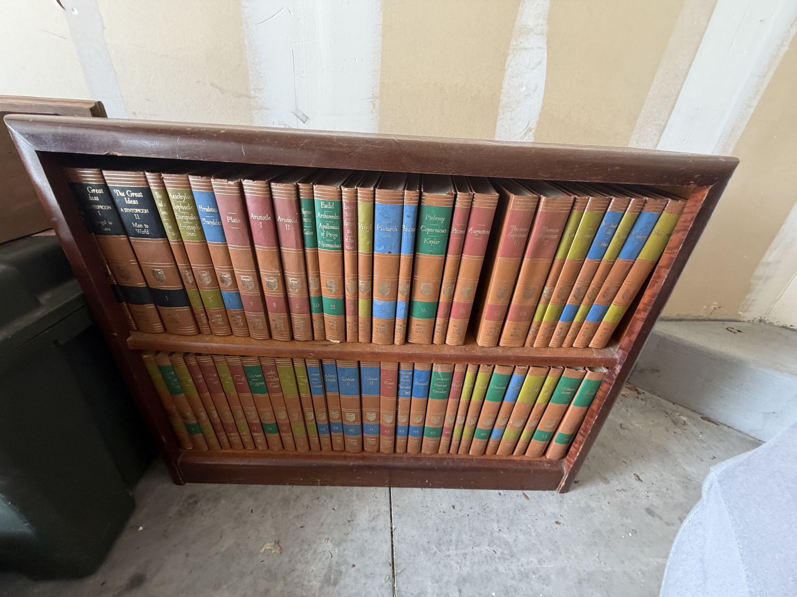 Vintage 1952 Encyclopedia Britannica "Great Books of the Western World" 54-volume set, housed in a wooden bookshelf.