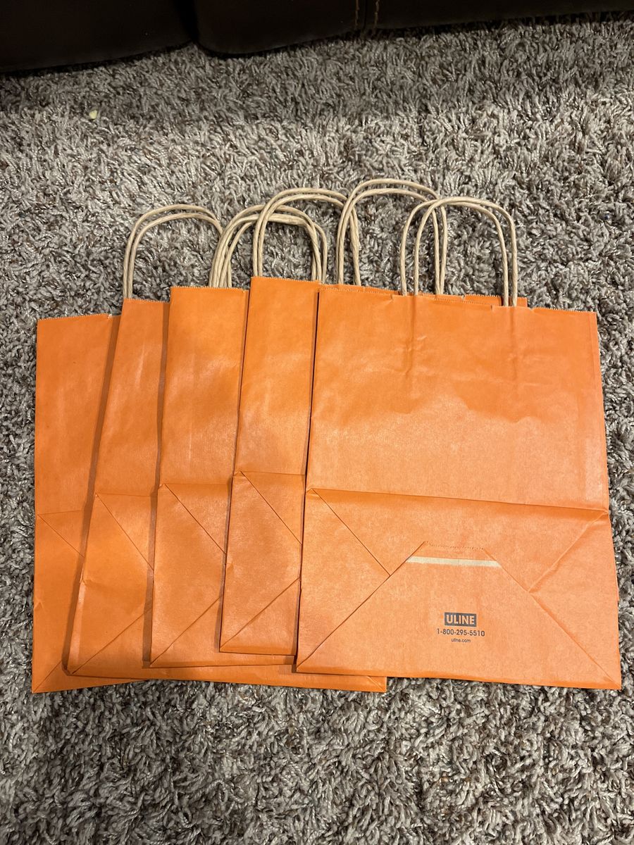 gift bags.  orange  new 5 for 1.00