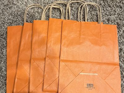 gift bags. orange new 5 for 1.00